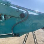 水色の重機とホース