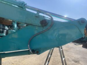 水色の重機とホース